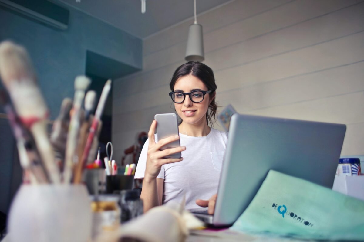 Smiling woman using her Android phone