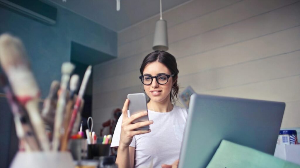 Smiling woman using her Android phone