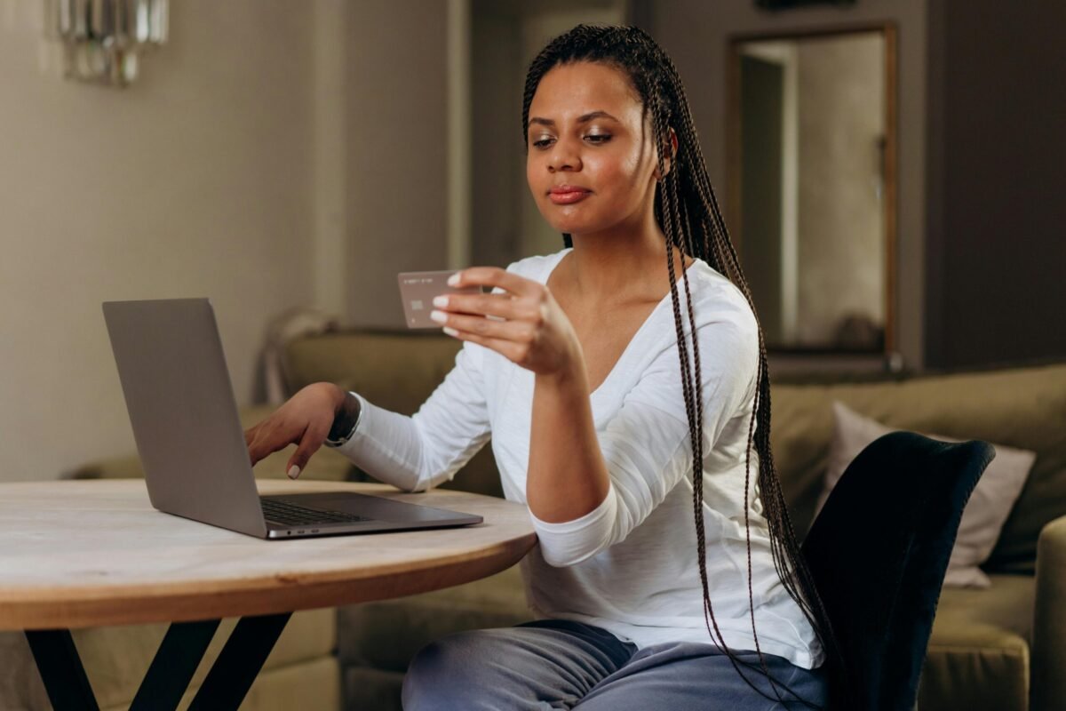 Woman shopping online using a laptop.