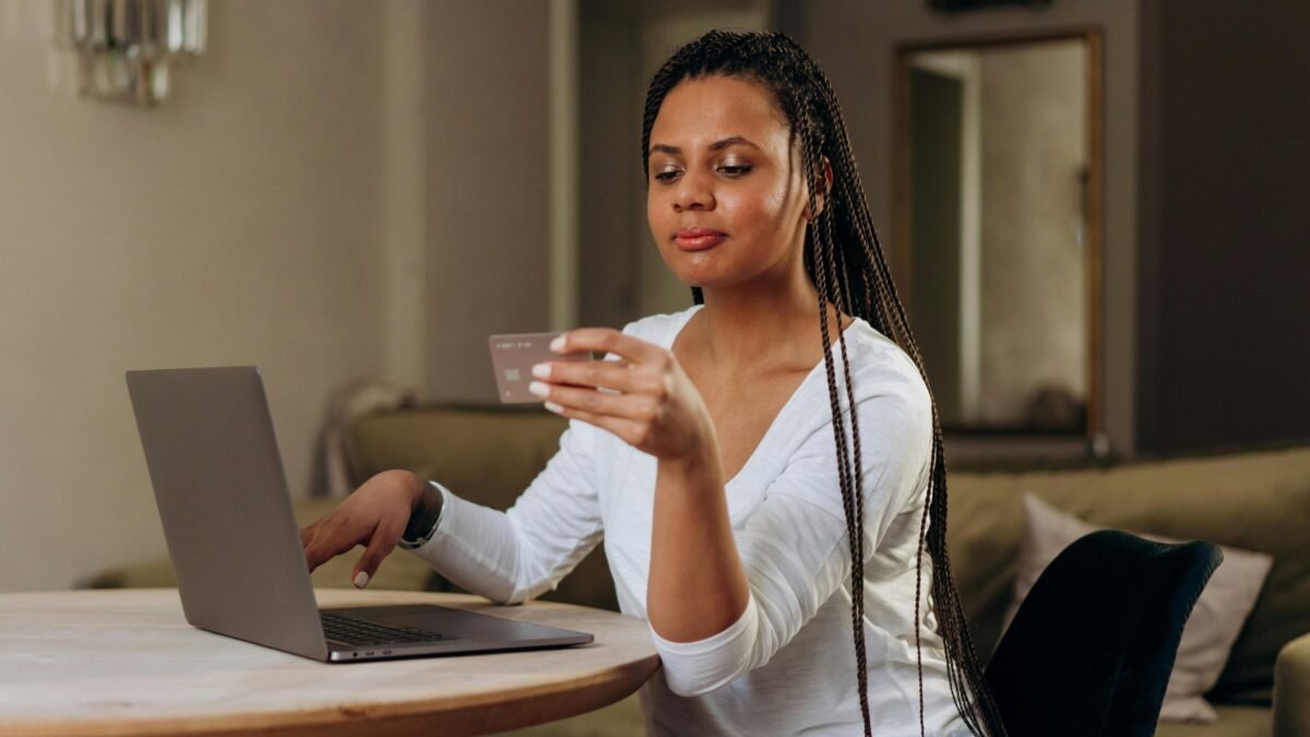 Woman shopping online using a laptop.