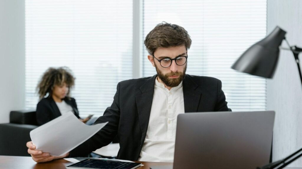 Person working on a laptop, practicing smart online habits to save time and money