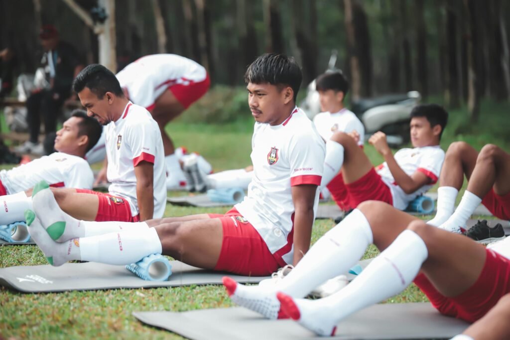 Football players training on the field with modern techniques and teamwork
