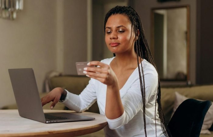 Woman shopping online using a laptop.