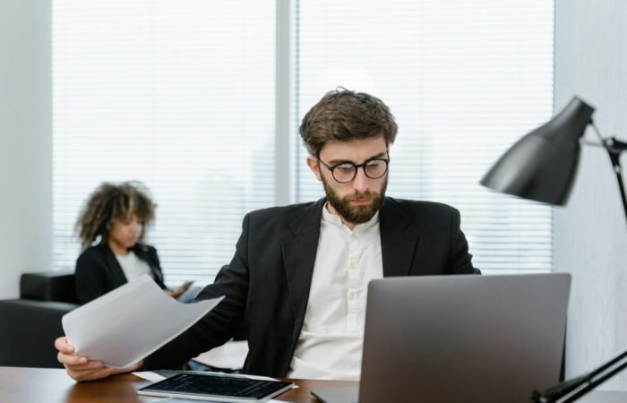 Person working on a laptop, practicing smart online habits to save time and money