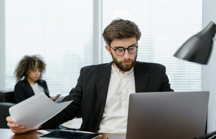 Person working on a laptop, practicing smart online habits to save time and money